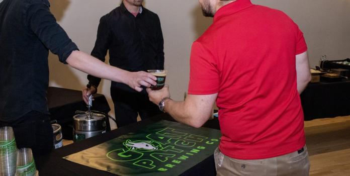 A man is served a beer