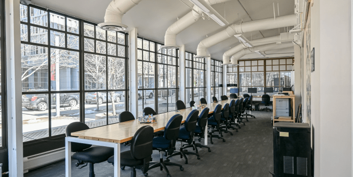 A long meeting table in a light airy room