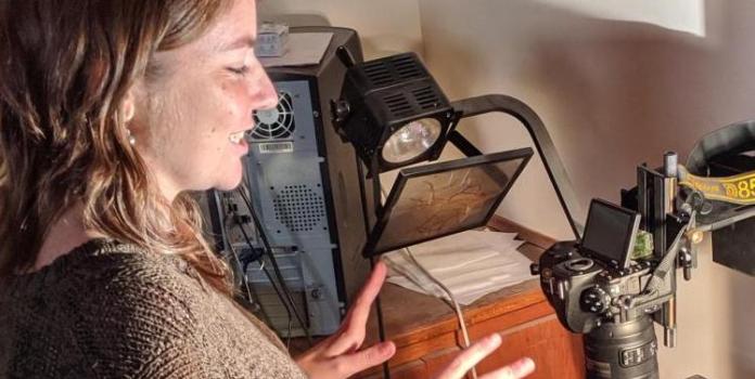 a woman in a lab with fossils