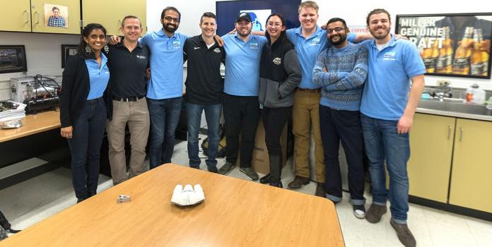 A group photo of engineers who designed the new material