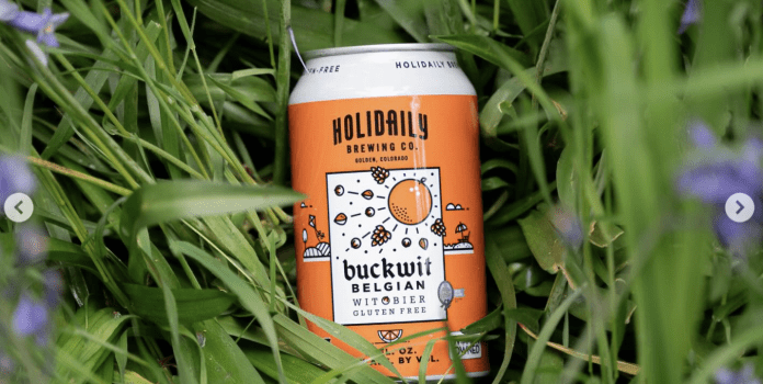 A can of Holidaily Beer surrounded by flowers