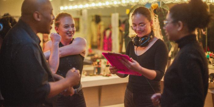 Backstage conversation of actors and crew