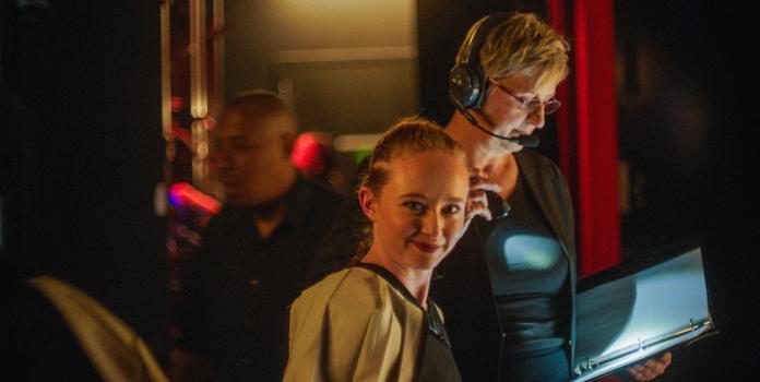 Backstage conversation between actors and director