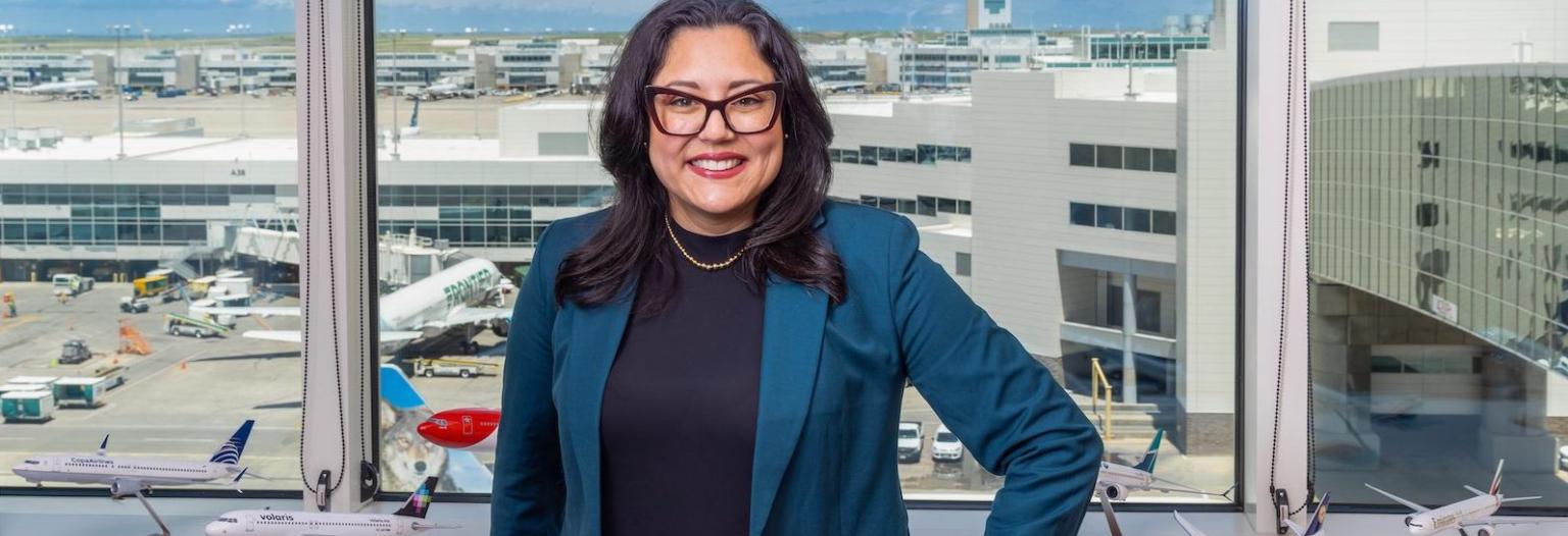 A woman poses for photo in an office 