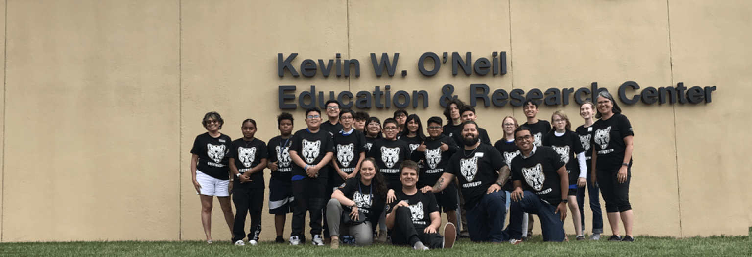 A group of students from the camp pose for a group photo